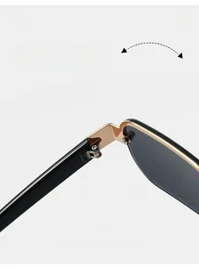 Close-up of durable gold metal hinges on trendy rimless sunglasses with black temples