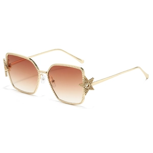 Fashionable oversized gold metal square sunglasses with gradient brown lenses and star detail