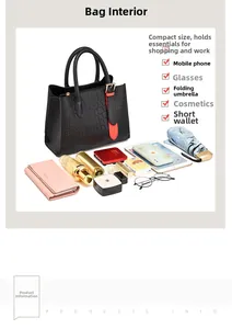 Detail of black crocodile texture PU tote bag with orange buckle and spacious storage