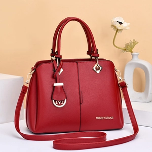 Deep red lychee grain leather crossbody handbag with elegant gold hardware accents