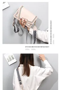 Detail of beige PU leather bag with geometric embroidery and ethnic woven strap