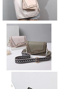 Detail of trendy PU leather crossbody bag with geometric embroidery and wide woven strap