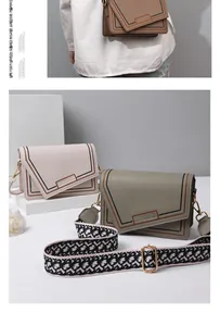 Detail of PU leather crossbody bag with contrast stitching and decorative fabric strap
