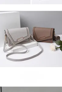 Detail showing wave stitching and brand logo on PU leather crossbody flap bags