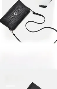Detail view of black crocodile pattern crossbody bag with silver twist lock and capacity info