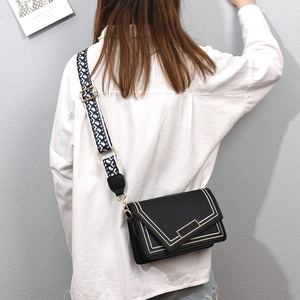 Fashionable black PU leather crossbody bag with geometric woven strap and flap closure