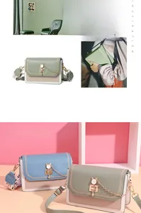 Detail of macaron square bag featuring owl-shaped hardware and dual detachable straps