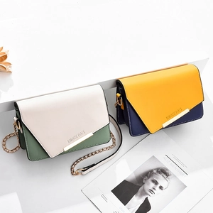Contrast color PU leather crossbody bag with chain strap and gold trim in Romantic Paris style