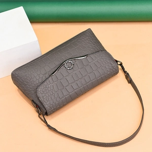 Elegant dark grey crocodile pattern crossbody handbag with a decorative rhinestone buckle