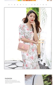 Detail of pink and beige crossbody bag with cat-shaped gold lock and floral wide strap