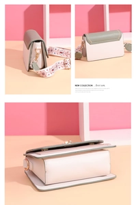 Close-up of pink square bag with embroidered floral strap and premium stitching