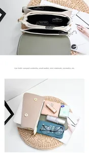 Detailed view of triple compartment interior in color-blocked PU leather crossbody bag