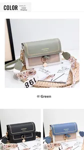 Detail view of stylish crossbody bags with embroidered wide straps in green, black, and blue