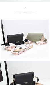Detail of color-block crossbody bag featuring high-quality faux leather and wide floral strap