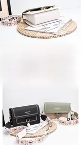 Detail of trendy small square bags featuring embroidered wide straps and metal pendants