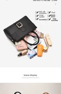 Spacious interior of stone-patterned bag holding iPad, umbrella, and daily essentials
