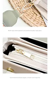 Close-up of golden metal hooks and smooth zipper on a chic color-block crossbody bag