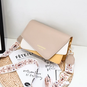Chic tricolor PU leather crossbody bag with floral jacquard strap and gold hardware accents