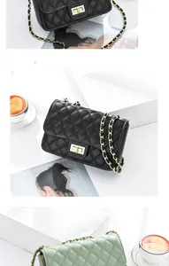 Detail of quilted leather chain bag featuring gold metal twist lock and elegant texture