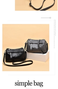 Detail of minimalist black and grey faux leather small square crossbody bags with metallic zipper
