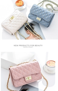 Close-up of quilted leather chain bags in beige, blue and pink with gold hardware