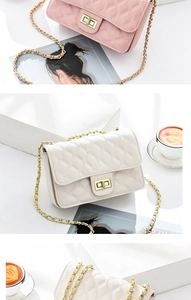 Close-up of quilted PU leather bags with metal turn-lock and chain straps in two colors
