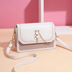 Chic two-tone pastel crossbody square bag with a cat-shaped golden clasp and pearl charm
