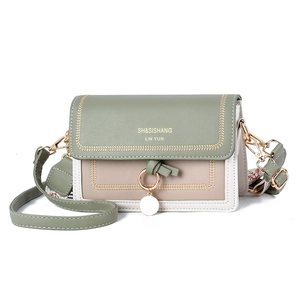 Three-color patchwork crossbody bag in morandi green and beige with metal ring and tassel
