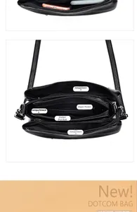 Internal view of black pebble leather shoulder bag with five organized storage compartments