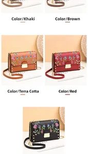 Close-up of small crossbody bags with floral embroidery in multiple vibrant colors