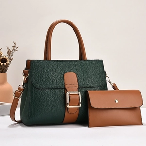 Dark green stone texture handbag set with brown handles and a matching envelope clutch