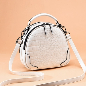 Chic beige crocodile-textured semi-circle handbag with handle and shoulder strap