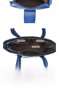 Vue intérieure du grand sac en cuir bleu marine avec structure multi-poches organisée