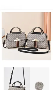 Detail of crossbody bag with classic logo pattern and signature stripe webbing trim