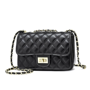 Classic black quilted leather crossbody bag with elegant gold chain strap and turn-lock