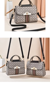 Detail view of the vintage floral crossbody bag with luxury stripes and gold buckle hardware