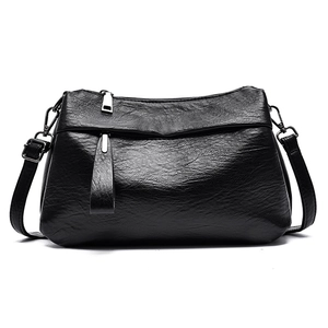 Classic black faux leather crossbody bag with lychee texture and silver hardware accents