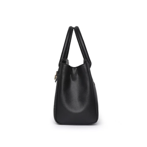 Classic black pebbled leather tote bag showing a sleek trapezoid side profile