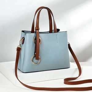Chic light blue lychee pattern tote bag with brown handles and gold ring hardware