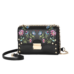 Fashionable black PU leather crossbody bag with colorful floral embroidery and gold rivets
