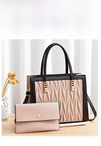Detail view of khaki PU leather handbag and wallet set with V-shaped quilted texture
