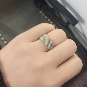 Minimalist silver mesh ring with industrial woven texture for men and women