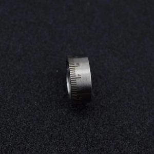 Macro shot of industrial stainless steel ring with engraved scale numbers 5 to 10