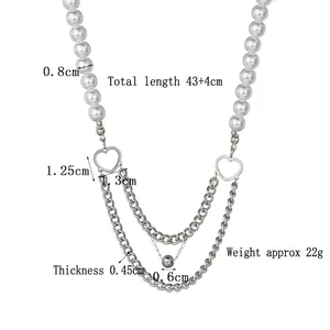 Collier en acier titane avec maillons double cœur, perles blanches et chaînes cubaines