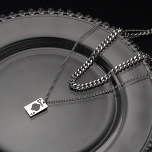 Minimalist double-layer spade pendant necklace with a sleek silver-tone cuban chain set