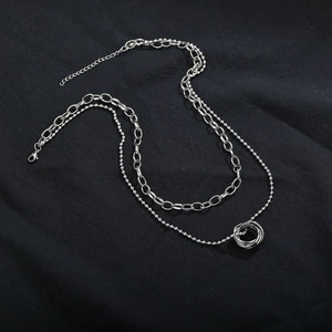 Double-layered silver titanium steel necklace featuring interlocked triple rings pendant