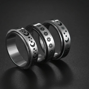 Three-piece silver celestial ring set with moon star and daisy engravings for women