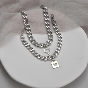 Minimalist stainless steel chain bracelet set featuring heart lock and key charms