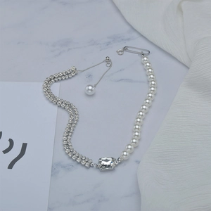 Double-layer necklace with pearls, zircon rows and an emerald-cut crystal main stone