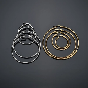 Polished stainless steel hoop earrings in gold and silver set with multiple size options